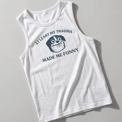 Funny T-shirt featuring a cartoon dog and humorous text about trauma. — printed on a tank top
