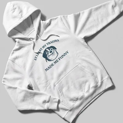 Funny T-shirt featuring a cartoon dog and humorous text about trauma. — printed on a unisex hoodie