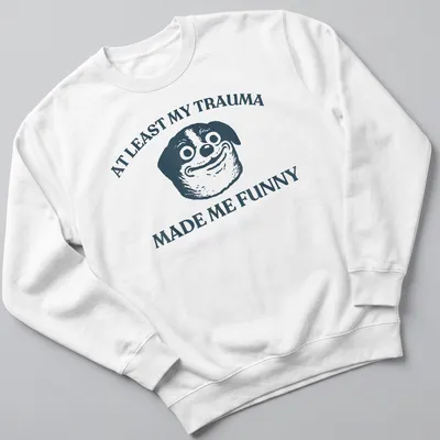 Funny T-shirt featuring a cartoon dog and humorous text about trauma. — printed on a unisex sweatshirt