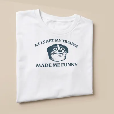 Funny T-shirt featuring a cartoon dog and humorous text about trauma. — printed on a unisex t-shirt (angled view)