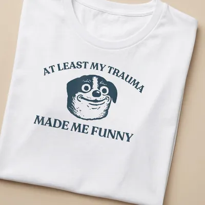 Funny T-shirt featuring a cartoon dog and humorous text about trauma. — printed on a women's shirt