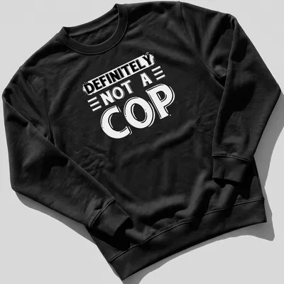 Bold typography shirt stating 'DEFINITELY NOT A COP' in black and white — printed on a unisex sweatshirt