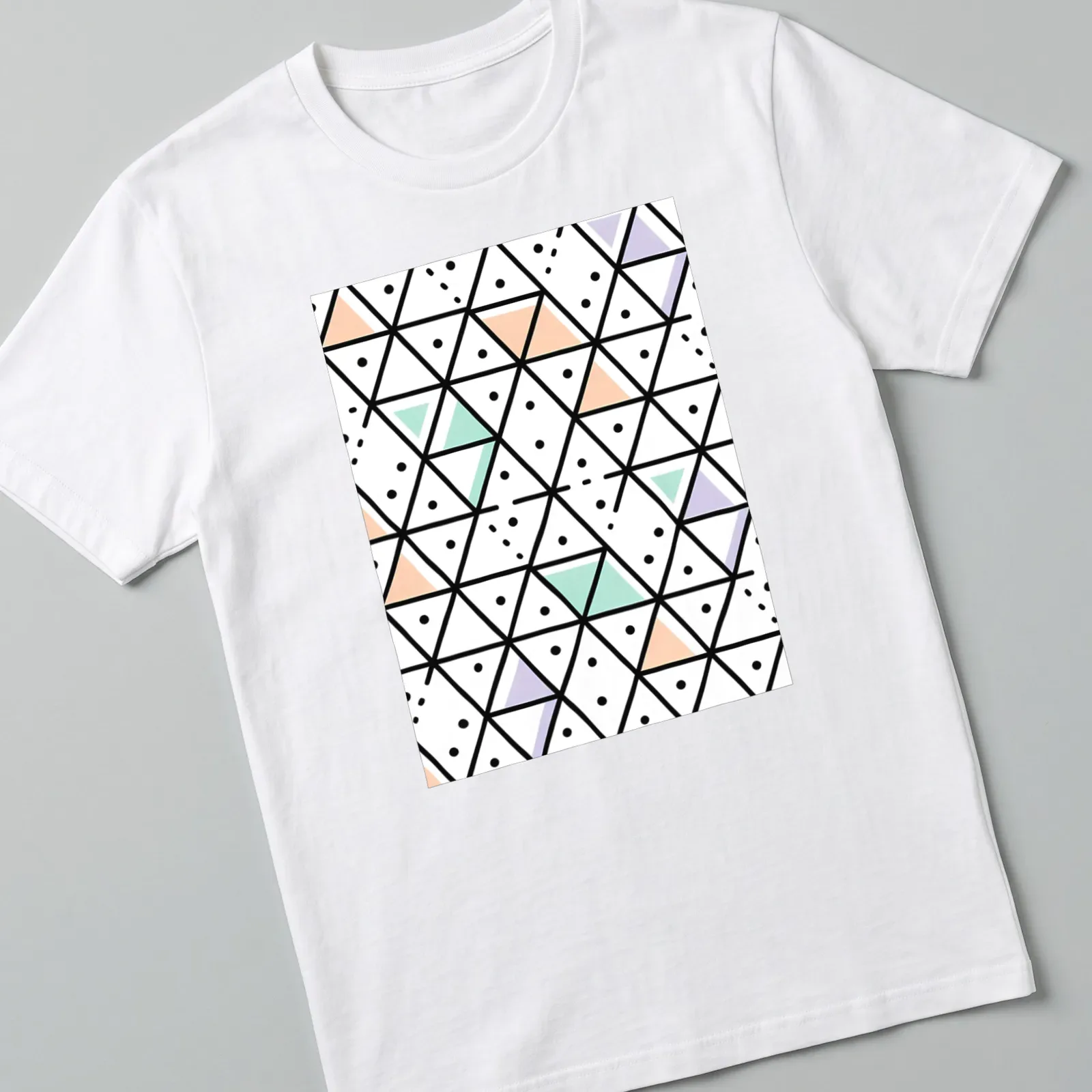 Modern seamless geometric triangle pattern in black, white, peach, mint green, and lavender. — printed on a unisex t-shirt