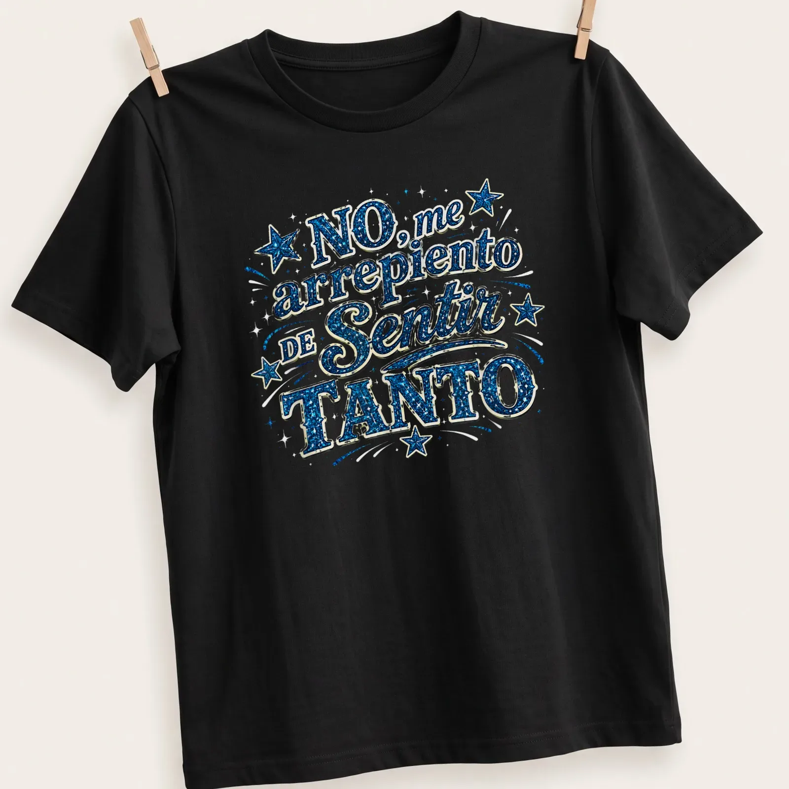 Glittery stars with the phrase No, me arrepiento de Sentir TANTO in blue, white, and black — printed on a unisex t-shirt