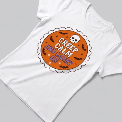 Vintage Halloween shirt with skull and bats around the phrase Creep Calm and Carry On — printed on a women's shirt