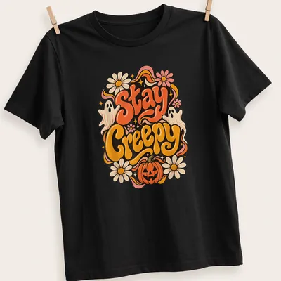 Vintage colorful Halloween shirt with ghosts and pumpkin, featuring 'Stay Creepy' text