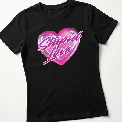 Glossy heart graphic with the text 'Stupid Love' in playful lettering — printed on a women's shirt