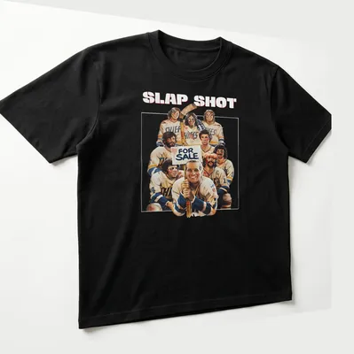 Vintage style shirt with 'SLAP SHOT FOR SALE' text and hockey player graphics. — printed on a unisex t-shirt (angled view)