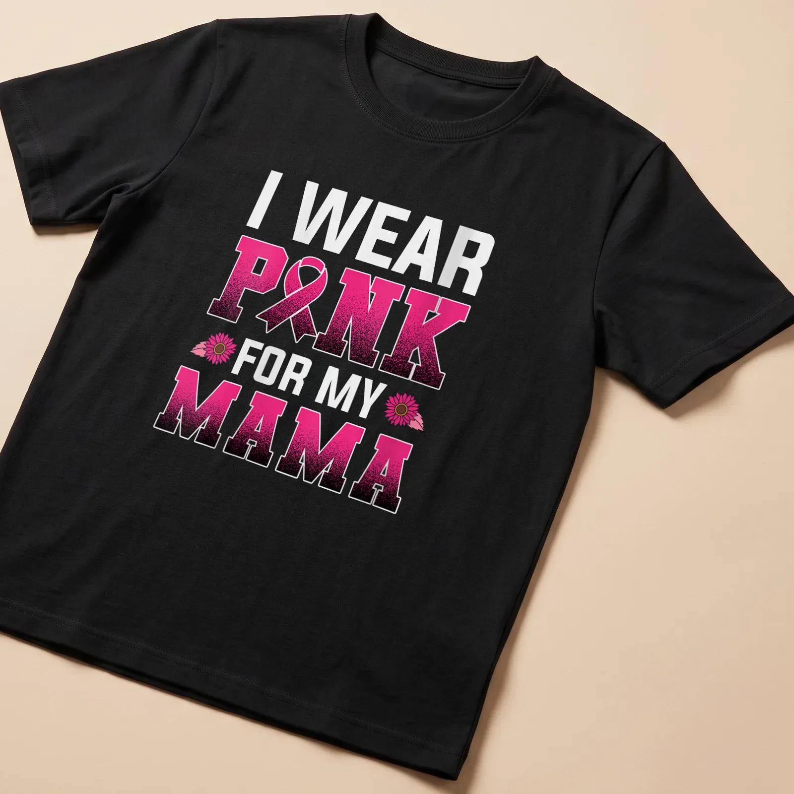 Bold graphic tee with the text 'I WEAR PINK FOR MY MAMA' and a pink ribbon — printed on a unisex t-shirt