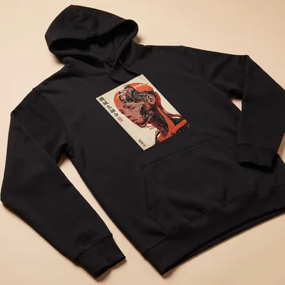 Japanese cyborg illustration with text in vibrant orange and black — printed on a unisex hoodie