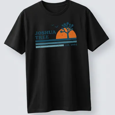 Retro distressed Joshua Tree t-shirt with vintage lettering and colors.