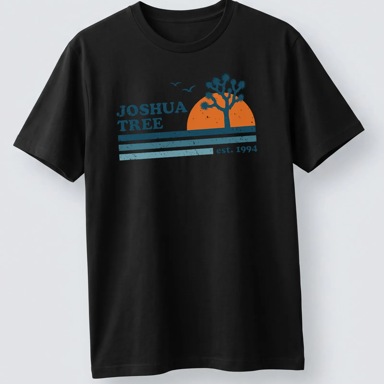 Retro distressed Joshua Tree t-shirt with vintage lettering and colors. — printed on a unisex t-shirt