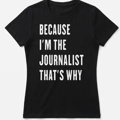 Bold white text reads 'BECAUSE I'M THE JOURNALIST THAT'S WHY' — printed on a women's shirt