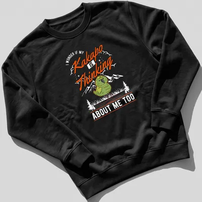 Cartoonish Kakapo bird with thinking expression and text 'Kakapo Is Thinking' — printed on a unisex sweatshirt
