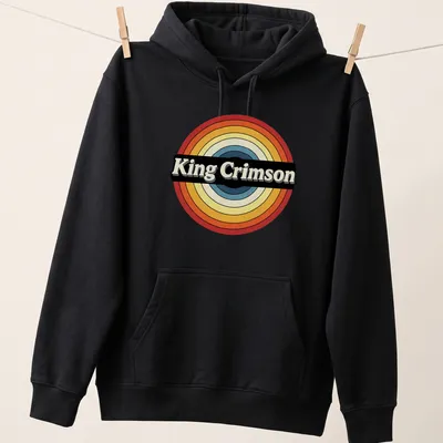 Retro King Crimson logo t-shirt in bold colors and circle design — printed on a unisex hoodie