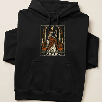 Vintage tarot card style t-shirt featuring a skeleton in a robe with LA MADRINA text — printed on a unisex hoodie