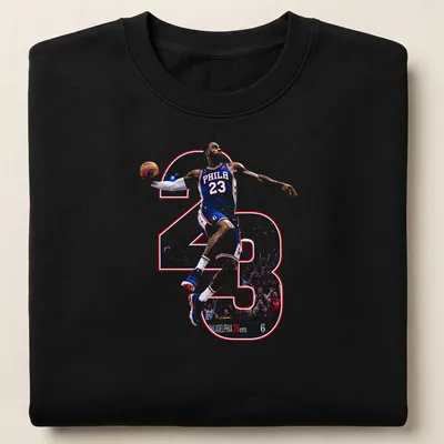 Dynamic illustration of LeBron James with 'PHILA 23' printed in blue, red, and white. — printed on a unisex sweatshirt