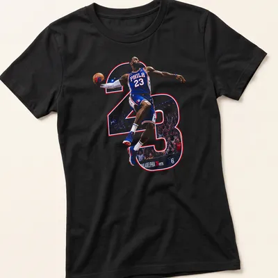 Dynamic illustration of LeBron James with 'PHILA 23' printed in blue, red, and white. — printed on a women's shirt