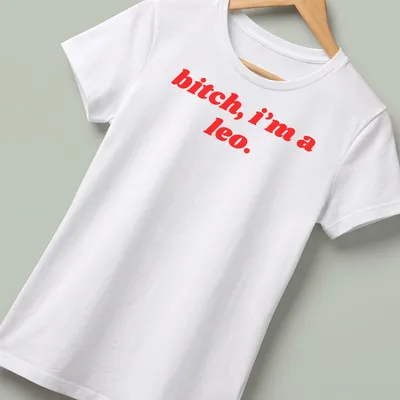 Bold typography Leo Zodiac sign t-shirt with red text — printed on a women's shirt