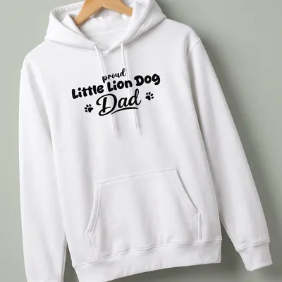 Bold typography t-shirt stating 'proud Little Lion Dog Dad' with playful Little Lion Dog illustration — printed on a unisex hoodie