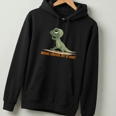 Cartoon lizard graphic with text about moving forward out of habit in green and orange — printed on a unisex hoodie