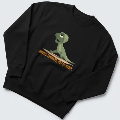 Cartoon lizard graphic with text about moving forward out of habit in green and orange — printed on a unisex sweatshirt