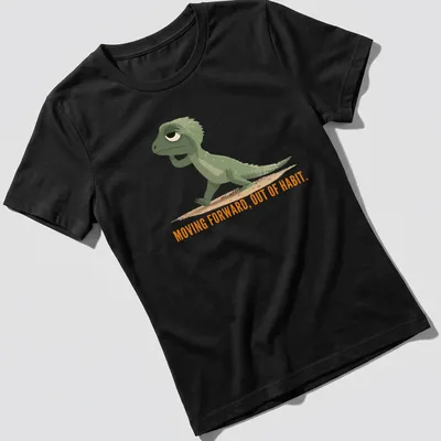 Cartoon lizard graphic with text about moving forward out of habit in green and orange — printed on a women's shirt