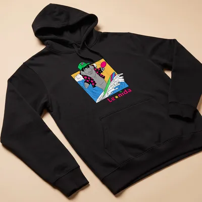 Cartoon manatee surfing with colorful text that reads I love vacation Leonida — printed on a unisex hoodie