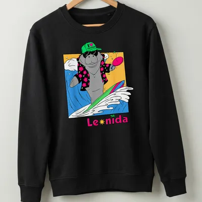 Cartoon manatee surfing with colorful text that reads I love vacation Leonida — printed on a unisex sweatshirt