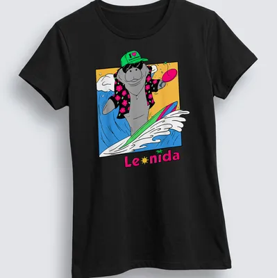 Cartoon manatee surfing with colorful text that reads I love vacation Leonida — printed on a women's shirt
