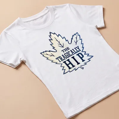 Bold graphic of The Tragically Hip with a maple leaf in white and navy — printed on a women's shirt