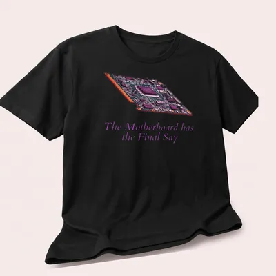 Digital illustration of a motherboard with bold text: The Motherboard has the Final Say — printed on a unisex t-shirt (angled view)