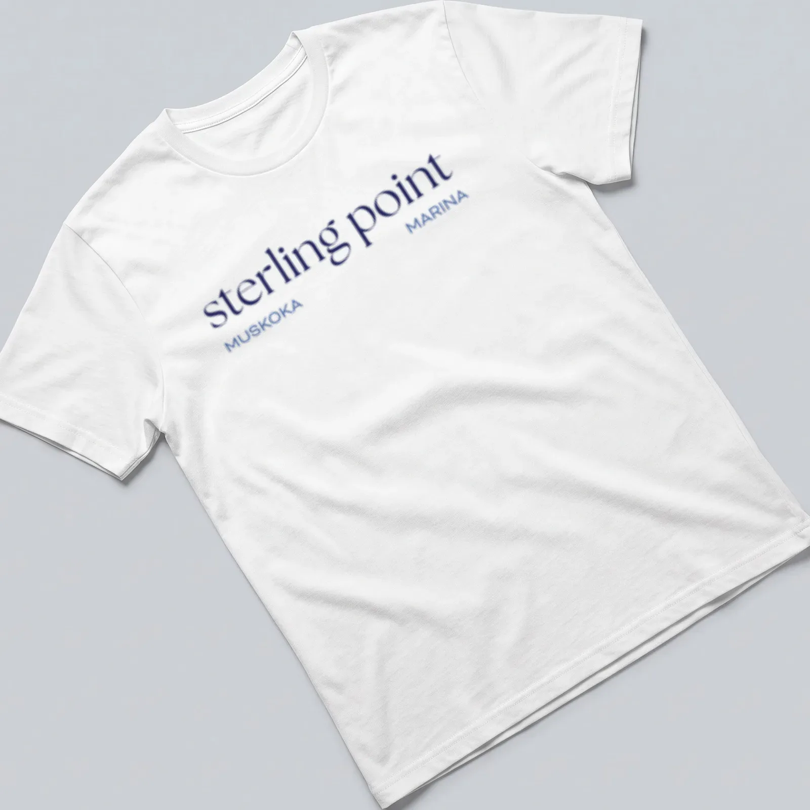 Clean modern Muskoka Marina T-shirt featuring Sterling Point text and lake illustration. — printed on a unisex t-shirt