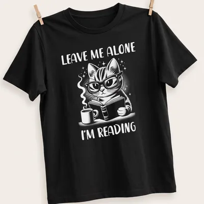 Cute illustration of a nerdy cat reading a book with the text Leave Me Alone I'm Reading