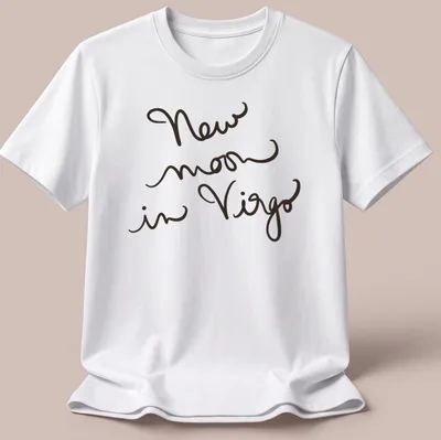 Handwritten script design reading 'New moon in Virgo' in black text