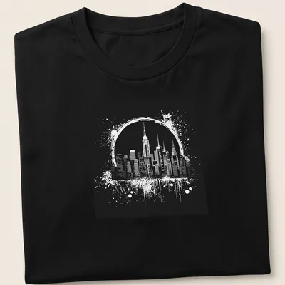 Ink splatter design of the New York City skyline in black and white — printed on a unisex t-shirt