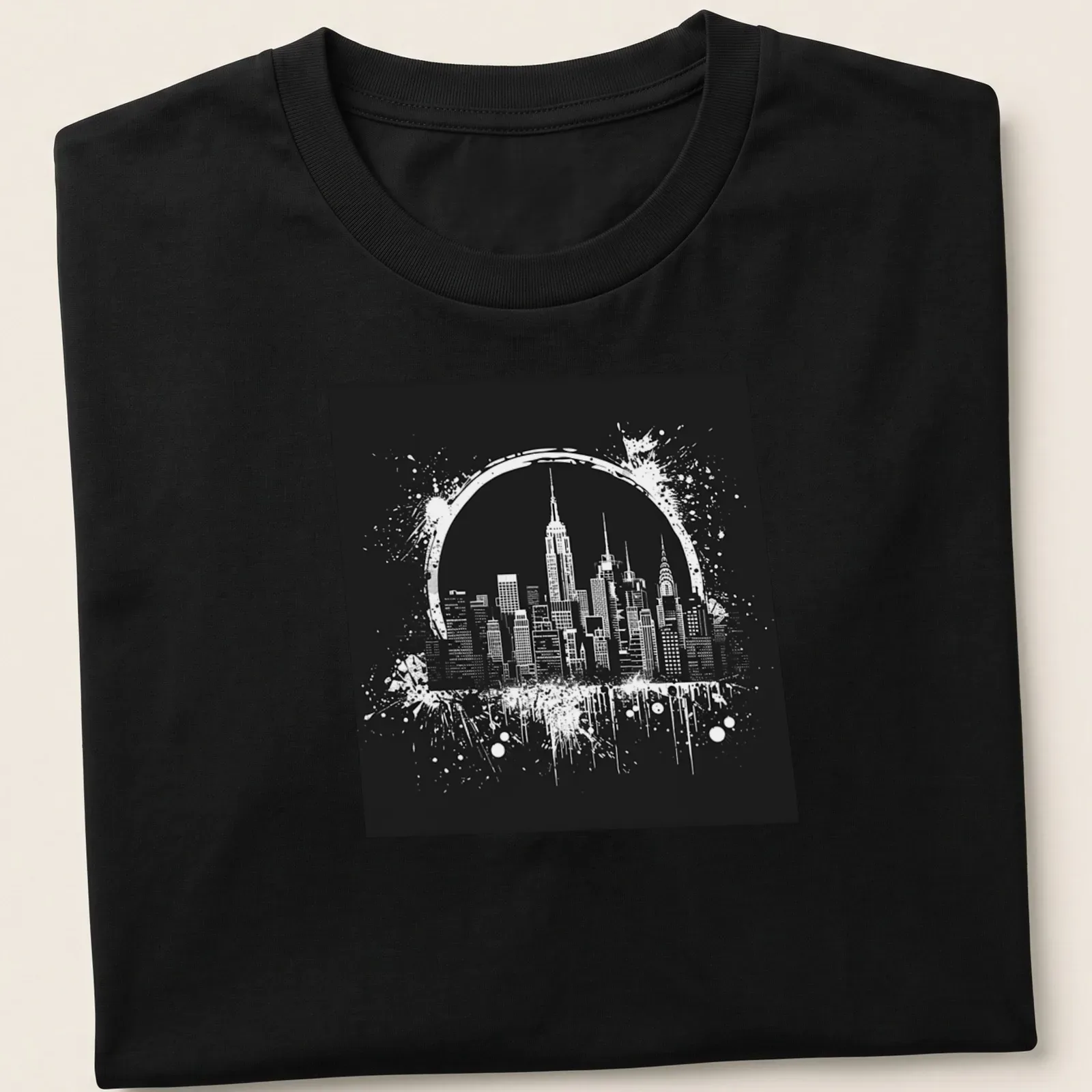 Ink splatter design of the New York City skyline in black and white — printed on a unisex t-shirt