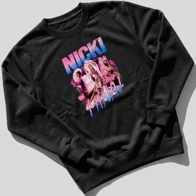 Pop art design featuring Nicki Minaj in vibrant pink, blue, white, and black colors. — printed on a unisex sweatshirt