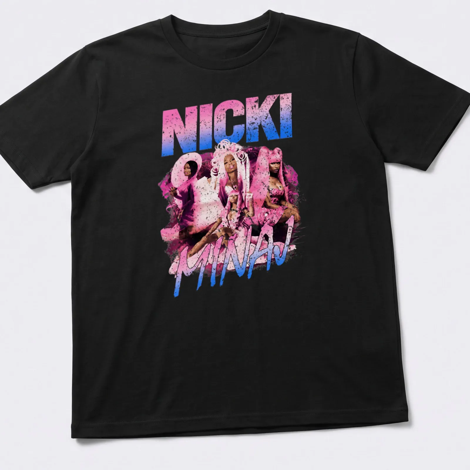 Pop art design featuring Nicki Minaj in vibrant pink, blue, white, and black colors. — printed on a unisex t-shirt
