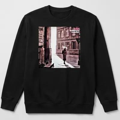 Vintage style shirt featuring a person in a trench coat labeled 'camel stationary traveller' — printed on a unisex sweatshirt