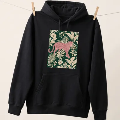 Pink leopard design surrounded by tropical leaves in vibrant colors. — printed on a unisex hoodie