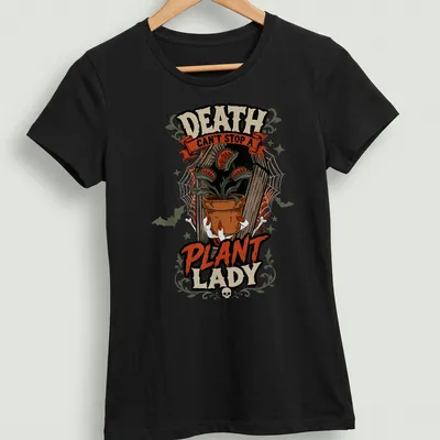 Vintage Halloween tee with a carnivorous plant and playful text about plant ladies. — printed on a women's shirt