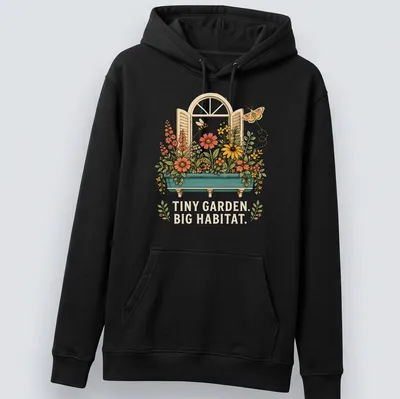 Vintage floral T-shirt featuring the text 'TINY GARDEN. BIG HABITAT.' with colorful flowers — printed on a unisex hoodie