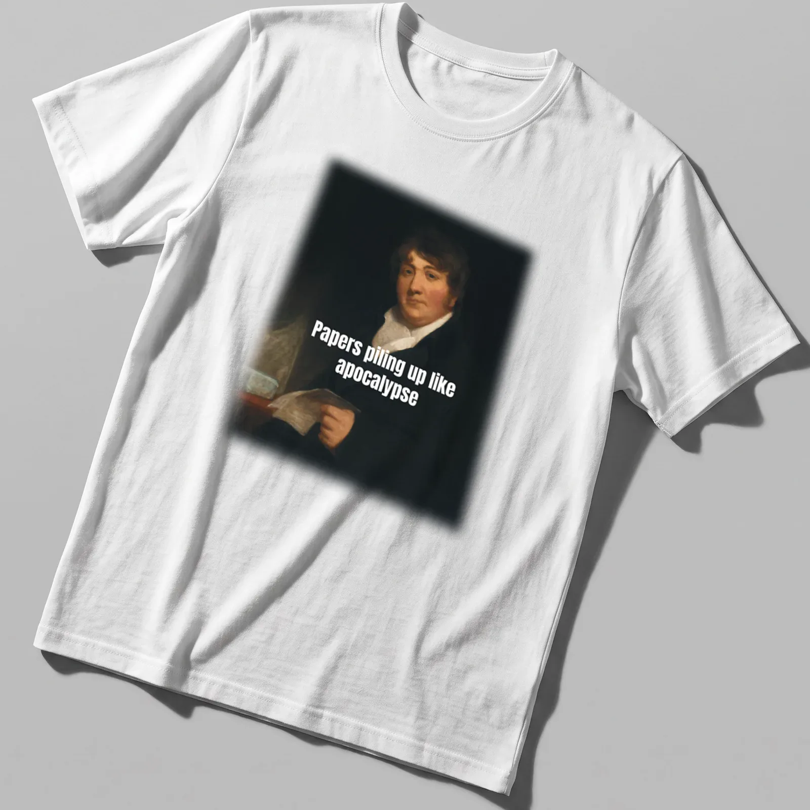 Classic portrait of a man overwhelmed by paperwork with humorous caption — printed on a unisex t-shirt