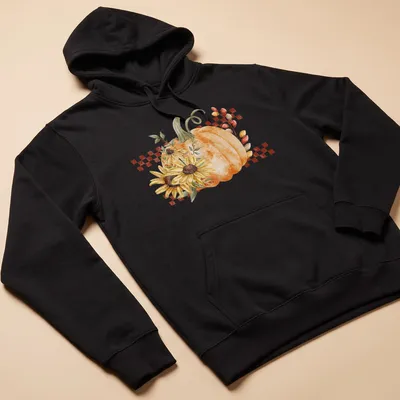 Boho style graphic of a pumpkin and sunflowers in warm autumn colors — printed on a unisex hoodie
