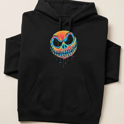 Colorful graffiti-style pumpkin design with drips in orange, blue, pink, and green — printed on a unisex hoodie