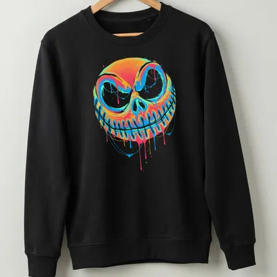 Colorful graffiti-style pumpkin design with drips in orange, blue, pink, and green — printed on a unisex sweatshirt