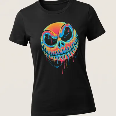 Colorful graffiti-style pumpkin design with drips in orange, blue, pink, and green — printed on a women's shirt