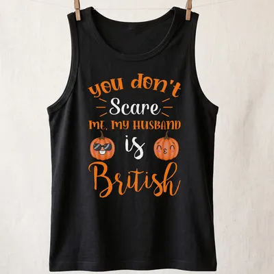 Kawaii pumpkin design with humorous text about a British husband. — printed on a tank top