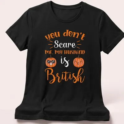 Kawaii pumpkin design with humorous text about a British husband. — printed on a women's shirt